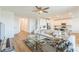 Open floor plan with a modern kitchen, living room with a decorative rug, and wood flooring at 2935 Gaffer Film St, Las Vegas, NV 89156