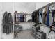 Spacious walk-in closet featuring multiple shelves, clothing rods, and storage drawers at 2935 Gaffer Film St, Las Vegas, NV 89156