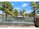 Scenic backyard view of gazebo and trees through the fence at 3526 Harbor Tides St, Las Vegas, NV 89147