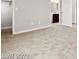 Bedroom featuring neutral carpet, light gray walls, and an ensuite bathroom at 3526 Harbor Tides St, Las Vegas, NV 89147