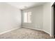 Neutral bedroom featuring a window and plush carpeting at 3526 Harbor Tides St, Las Vegas, NV 89147