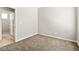 Cozy bedroom with neutral walls, plush carpeting and an interior door at 3526 Harbor Tides St, Las Vegas, NV 89147