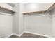 Walk-in closet featuring carpeted floors and shelving for ample storage at 3526 Harbor Tides St, Las Vegas, NV 89147