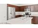 Well-equipped kitchen featuring stainless steel appliances, dark cabinetry, and light countertops at 3526 Harbor Tides St, Las Vegas, NV 89147
