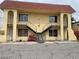 Two story exterior with stairs leading to the second floor and arched entryway at 4150 Solteros St, Las Vegas, NV 89103