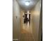 Hallway with tile floor leading to living areas, showing a well-lit and open space at 4150 Solteros St, Las Vegas, NV 89103
