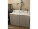 Laundry room with a white washer and dryer set at 4150 Solteros St, Las Vegas, NV 89103