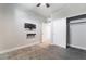 Carpeted bedroom with media console and walk-in closet at 4294 Eagle Summit Ave, Las Vegas, NV 89141