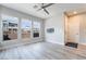 Sunlit bedroom with modern ceiling fan, light flooring, and ample windows at 4294 Eagle Summit Ave, Las Vegas, NV 89141