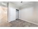 Carpeted bedroom featuring a closet and a hallway entryway at 4294 Eagle Summit Ave, Las Vegas, NV 89141