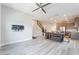 Open-concept living area with wood-look floors, and staircase at 4294 Eagle Summit Ave, Las Vegas, NV 89141