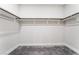 Spacious walk-in closet with carpet flooring and ample storage space at 4294 Eagle Summit Ave, Las Vegas, NV 89141