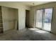 The bedroom has a closet and sliding glass doors for light at 4338 Caliente St # 8, Las Vegas, NV 89119