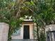Charming front entrance with a security door and lush greenery surrounding the entry at 4338 Caliente St # 8, Las Vegas, NV 89119