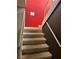 The stairwell has carpeted steps and a metal railing at 4338 Caliente St # 8, Las Vegas, NV 89119