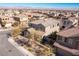 Aerial view of a two-story home in a planned community; desert mountains in the background at 436 Trevinca St, Las Vegas, NV 89138