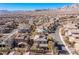 Aerial view of a stucco home in a planned community, set against a backdrop of mountains at 436 Trevinca St, Las Vegas, NV 89138