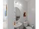 Cozy half bathroom featuring stylish pedestal sink, mirror and cute artwork at 436 Trevinca St, Las Vegas, NV 89138