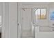 Modern bathroom with glass shower, tub, and window at 436 Trevinca St, Las Vegas, NV 89138