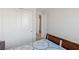 Bright bedroom with large closet, patterned bedding and an open door to another room at 436 Trevinca St, Las Vegas, NV 89138