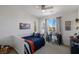 Bright bedroom with blue and orange accents, a desk and view out the window at 436 Trevinca St, Las Vegas, NV 89138