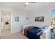 Bright bedroom with blue and orange accents, a desk and hallway view at 436 Trevinca St, Las Vegas, NV 89138