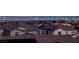 Residential rooftops and buildings in the distance with mountains and city skyline at 436 Trevinca St, Las Vegas, NV 89138