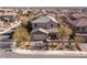 This home's front elevation has desert landscaping, a two-car garage, and a brick driveway at 436 Trevinca St, Las Vegas, NV 89138