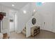 Bright foyer with high ceilings, wood-look tile flooring, decorative console table, and a staircase at 436 Trevinca St, Las Vegas, NV 89138