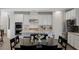 Bright kitchen features granite counters, stainless appliances, double oven and dining area at 436 Trevinca St, Las Vegas, NV 89138