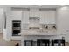 Modern kitchen with granite counters, stainless appliances, double oven and an island sink at 436 Trevinca St, Las Vegas, NV 89138