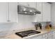 Modern kitchen boasts stainless steel range hood and granite countertops at 436 Trevinca St, Las Vegas, NV 89138