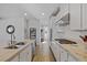 Modern kitchen with granite countertops, stainless steel appliances and a central island with seating at 436 Trevinca St, Las Vegas, NV 89138