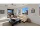 Bright living room featuring a large window and comfortable seating at 436 Trevinca St, Las Vegas, NV 89138