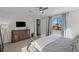 Well-lit main bedroom with a ceiling fan, dresser, and comfortable bed at 436 Trevinca St, Las Vegas, NV 89138