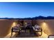 Cozy rooftop deck with a modern fireplace and comfortable seating under the evening sky at 436 Trevinca St, Las Vegas, NV 89138