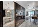 A luxurious bathroom features a glass shower, modern lighting, and marble countertops at 4381 W Flamingo Rd # 3206, Las Vegas, NV 89103