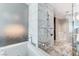Bright bathroom with modern tub, marble accents, and a glass shower, creating a spa-like retreat at 4381 W Flamingo Rd # 3206, Las Vegas, NV 89103