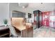 This modern kitchenette features stainless steel appliances, a wood table, and stylish gray tile flooring at 4381 W Flamingo Rd # 3206, Las Vegas, NV 89103