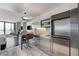 This sleek kitchenette features stainless steel appliances and modern lighting in an open-concept living space at 4381 W Flamingo Rd # 3206, Las Vegas, NV 89103
