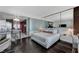 Sleek living space with modern kitchen access, featuring a large bed, and chic lounge area at 4381 W Flamingo Rd # 3206, Las Vegas, NV 89103