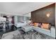 Open-concept living area with bedroom, lounge, and kitchen access, filled with natural light at 4381 W Flamingo Rd # 3206, Las Vegas, NV 89103