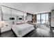 Spacious main bedroom featuring sleek decor, a seating area, and city views at 4381 W Flamingo Rd # 3206, Las Vegas, NV 89103