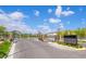 View of the Noble Peak community entrance, with blue skies, landscaping, and entry gates at 4526 Cloudrest Peak St, North Las Vegas, NV 89031