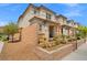 Contemporary townhome with desert landscaping, offering low maintenance and modern curb appeal in a vibrant community setting at 4526 Cloudrest Peak St, North Las Vegas, NV 89031