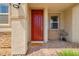 Charming home featuring a bright red front door with a welcoming entrance at 4526 Cloudrest Peak St, North Las Vegas, NV 89031
