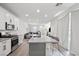 Open-concept living area boasts a modern kitchen, comfortable seating, and a seamless flow, great for entertaining at 4526 Cloudrest Peak St, North Las Vegas, NV 89031