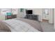 Bright main bedroom boasts neutral tones, carpeted floors, and a vanity with decorative mirror accents at 4526 Cloudrest Peak St, North Las Vegas, NV 89031