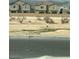 View of neighborhood houses, with some desert landscaping and distant mountains at 4526 Cloudrest Peak St, North Las Vegas, NV 89031