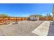 Fenced backyard featuring gravel landscaping, a picnic table, fire pit, and small shed at 474 Adelle Ave, Overton, NV 89040